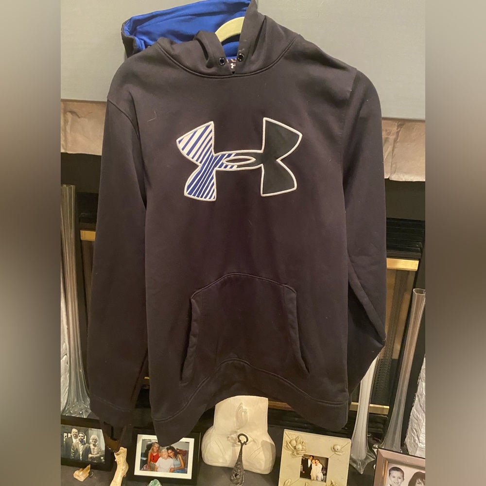 2 Men’s like new Under Armour Hoodies. 1 blue medium, and 1 large khaki